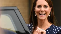 Kate Middleton, whose clothes have gone from 'businesslike' to more 'feminine' in 2023, smiles