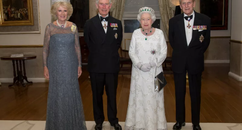 King Charles III, whose childhood drawings of Queen Elizabeth and Prince Philip are being auctioned, stands with Queen Camilla and his parents