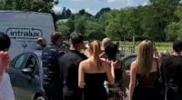 Friends and family of David Baerten appeared to be in disbelief as they looked up to the sky, witnessing his arrival to his own funeral