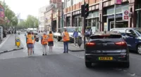 Just Stop Oil protesters in Waterloo London - cars having to move out of the way as they block the road