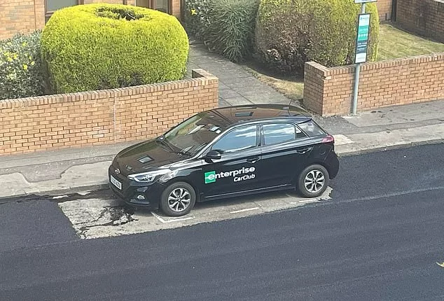 In the way: Residents were left bemused after a solitary black Hyundai remained in place during resurfacing works in Craighouse Gardens, Edinburgh