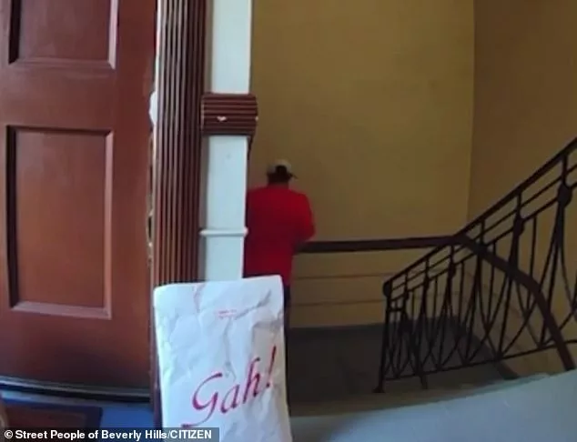 Shocking doorbell footage shows the moment an Uber Eats delivery driver appears to urinate in the stairwell of a Los Angeles area apartment building