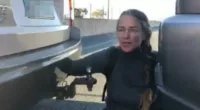 Blockade Australia protester Naomi Shine (pictured) blocked two lanes of traffic after chaining herself to two cars on the Port of Brisbane Motorway a kilometre east of the Pritchard Road exit on Wednesday