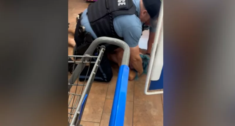 Video shows a man held down by police in a Kansas City Walmart