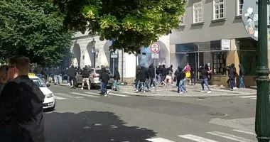 A group of partying West Ham fans were violently set upon by Fiorentina ultras this afternoon. Pictured: A video shows black-clad Italian football fans in Prague today