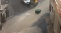 Flash flooding led to several wheelie bins being swept down a street in a torrent of water in the Murcian town of Moratalla