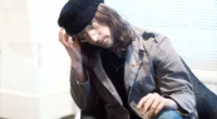 "Give Peace a Chance" singer John Lennon in a hat