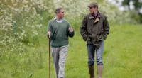 King Charles, who said he'd been 'moved' by Prince William's Duchy of Cornwall comments in a 2019 documentary, walks with Prince William at the Duchy Home Farm