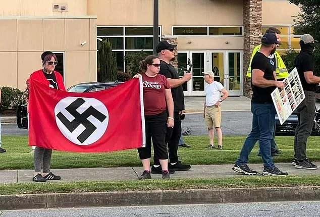 Around a dozen protesters stood outside a synagogue in Marietta, Georgia, on Saturday evening