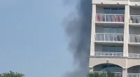 Smoke emanated from a golf course in North Myrtle Beach, South Carolina where a small plane crashed Sunday morning