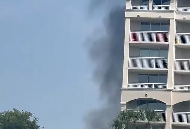 Smoke emanated from a golf course in North Myrtle Beach, South Carolina where a small plane crashed Sunday morning