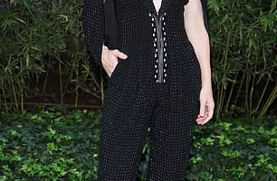 Cate Blanchett, 54, stuns in a daringly plunging black jumpsuit as she joins chic Lily Allen, 38, at Giorgio Armani show during Milan Fashion Week