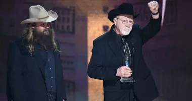 Chris Stapleton and Mike Henderson accept an award for country song of the year at the 52nd Annual CMA Awards in 2021