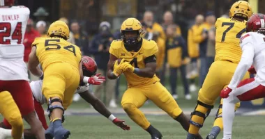 Nicco Marchiol throws TD pass in 1st start, West Virginia holds off Texas Tech 20-13