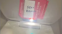 A 14-year-old girl found the camera right before she was about to flush the first-class toilet on aircraft 1441 traveling to Boston from Charlotte, North Carolina on September 2. Two makeshift 'remove from service' stickers were put on the seat by the male flight attendant, which held up the weight of the recording phone, it's alleged