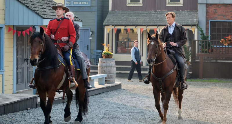 Nathan and Bill riding horses in