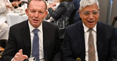 Tony Abbott and Warren Mundine sitting together.