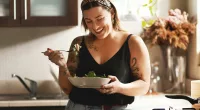 woman eating a salad on a diet