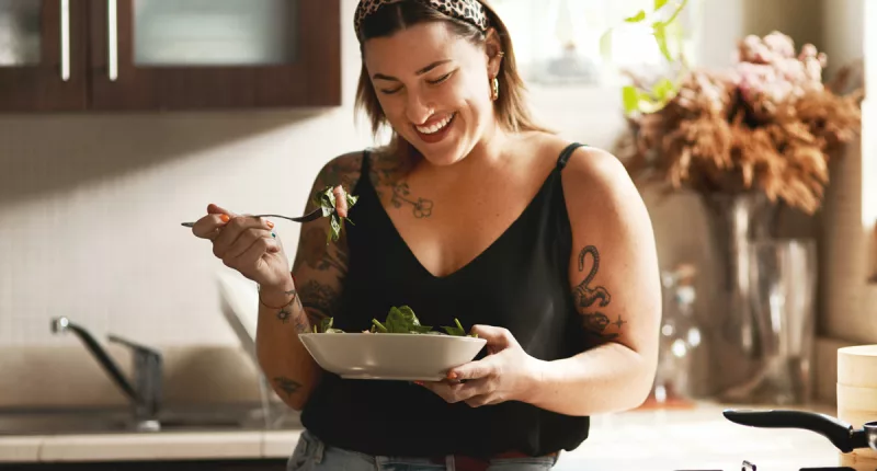 woman eating a salad on a diet