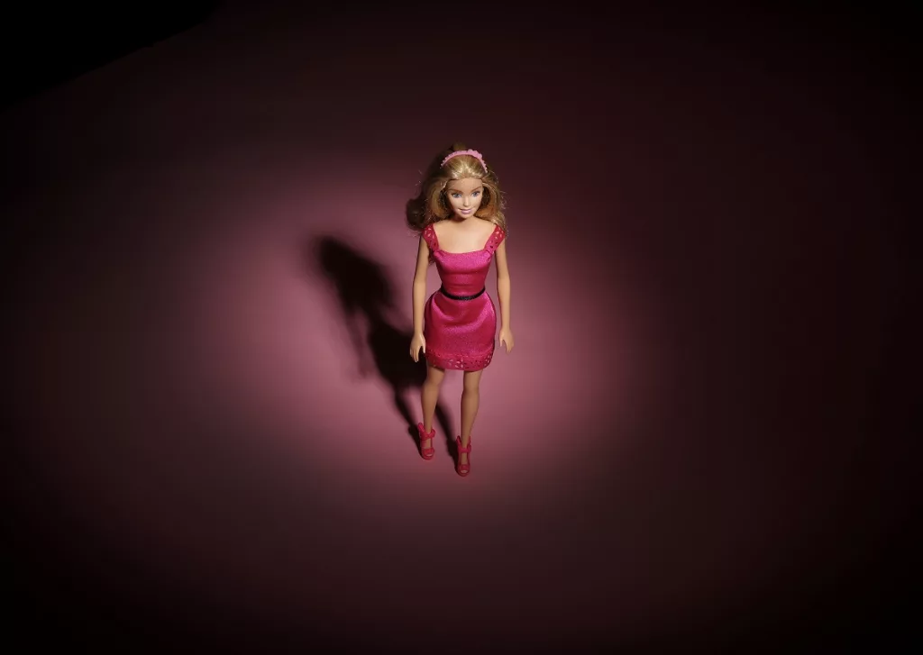 Barbie is seen in a spotlight. The popularity of the Barbie movie is sure to make it a popular Halloween costume, but SAG-AFTRA is asking union members to avoid such costumes.