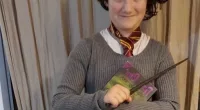 Harry Potter fan Noya Dan, 12, with Harry Potter wand and book