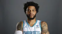 Bridges turns himself in after alleged  protection order violation