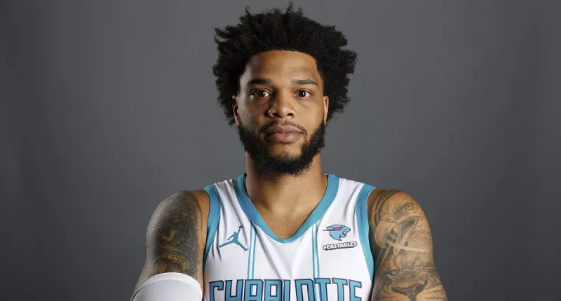 Bridges turns himself in after alleged  protection order violation