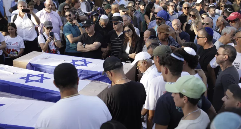 Hundreds of mourners gathered today to honour Brits Lianne Sharabi, 48 and daughters Noiya, 16, and Yahel, 13