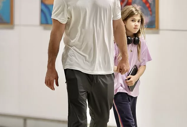 Chris Hemsworth jets into Brisbane with his daughter India after Icelandic adventure while his wife Elsa continues her holiday in Tokyo with their twin sons