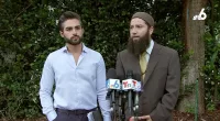 Dentist who was fired after tearing down hostage posters speaks out