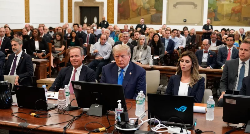 Former president Donald Trump (center) appeared in a New York courtroom on Monday for the first day of his trial