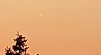 The three UFOs are seen in a triangle formation over Utica, New York, about 54 miles from Albany