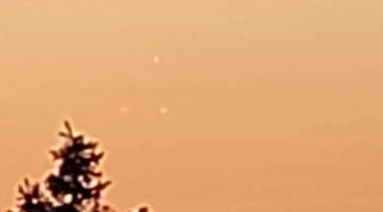 The three UFOs are seen in a triangle formation over Utica, New York, about 54 miles from Albany