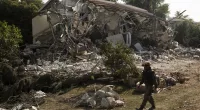 Rescue crews search for bodies after the Hamas attack on the Kibbutz in Be’eri
