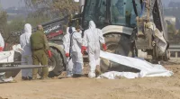 Bodies were still being recovered by Israeli troops as The Sun arrived