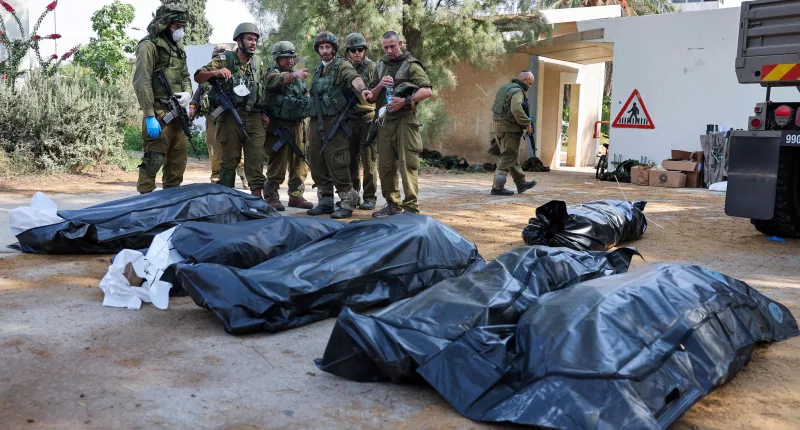 Entire families were gunned down by Hamas militants in Kfar Aza - a village close to the Gaza border
