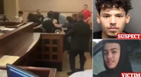 Handcuffed murder suspect is beaten-up by family of his 'victim'
