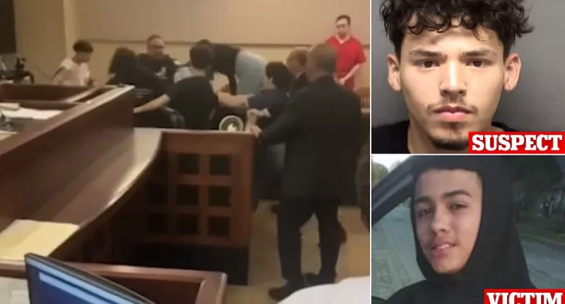 Handcuffed murder suspect is beaten-up by family of his 'victim'