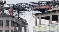 Workers were seen dangling from the wires