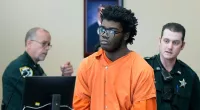 Hulking 6ft 6in boy, 17, who 'beat his teaching aide' appears in court