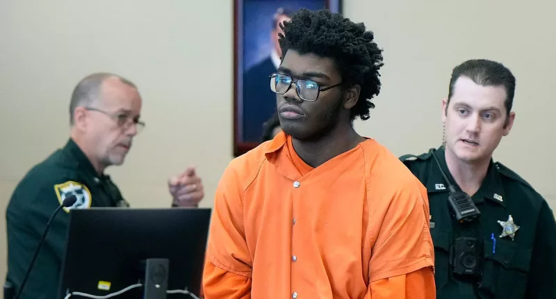 Hulking 6ft 6in boy, 17, who 'beat his teaching aide' appears in court