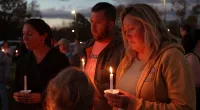Hundreds mourn victims of Maine mass shooting at candlelit vigil