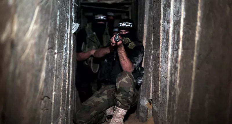 Armed fighters in one of the underground tunnels in Shujaya neighborhood of Gaza City