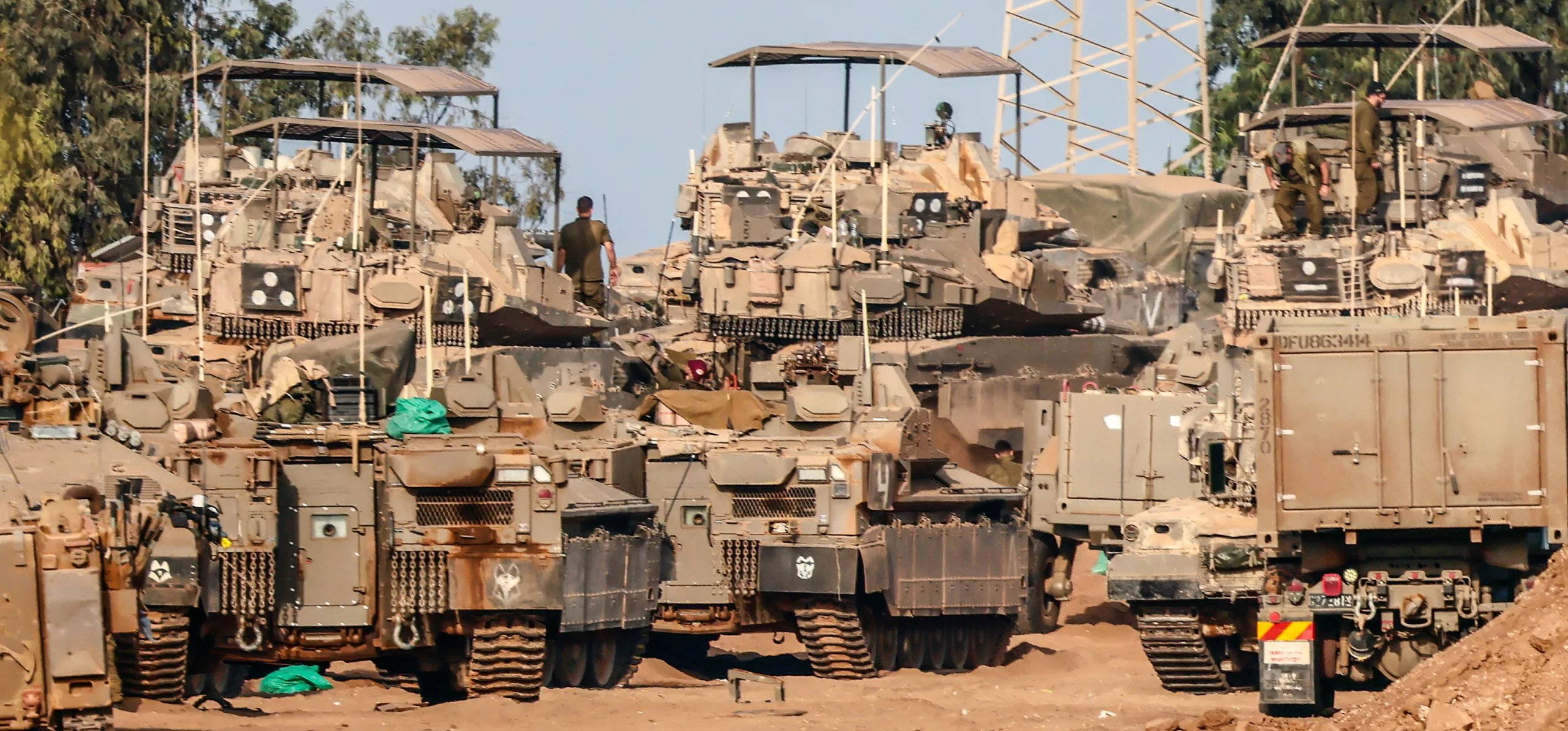 Israeli armoured vehicles gathered near the Gaza border, as the nation’s Shin Bet internal security service started hunting down Hamas monsters