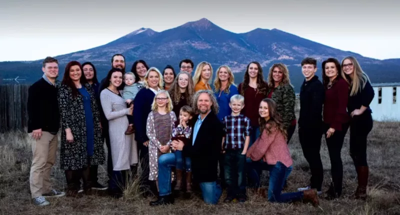 The Brown family is pictured together in a family portrait before the demise of their plural unions