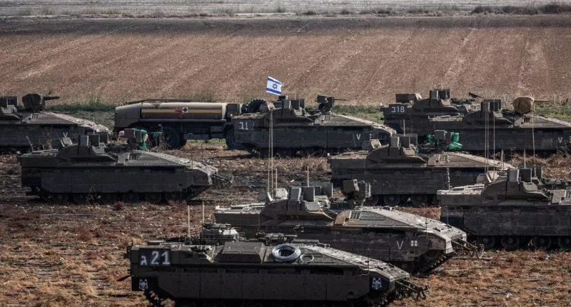 Israel gives Palestinian citizens deadline to flee Gaza as troops amass on border