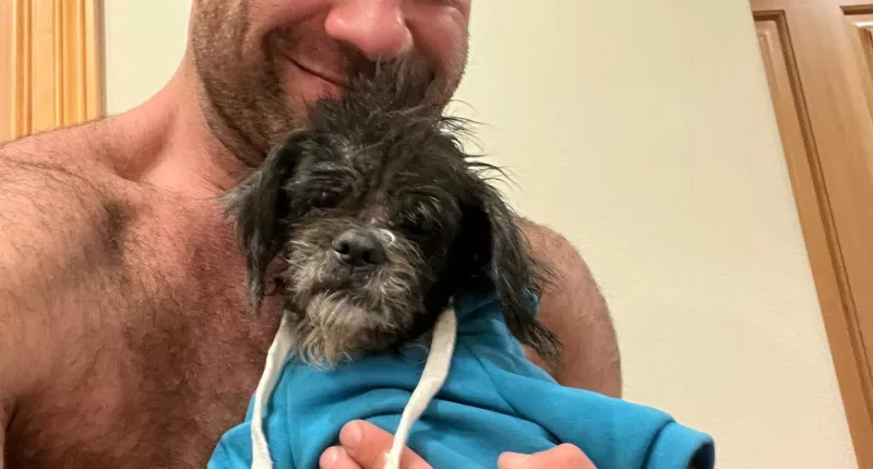 Lee was all smiles as he held up one of the pups he has recently rescued