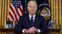 Joe Biden appears to read his teleprompter instructions in Oval speech