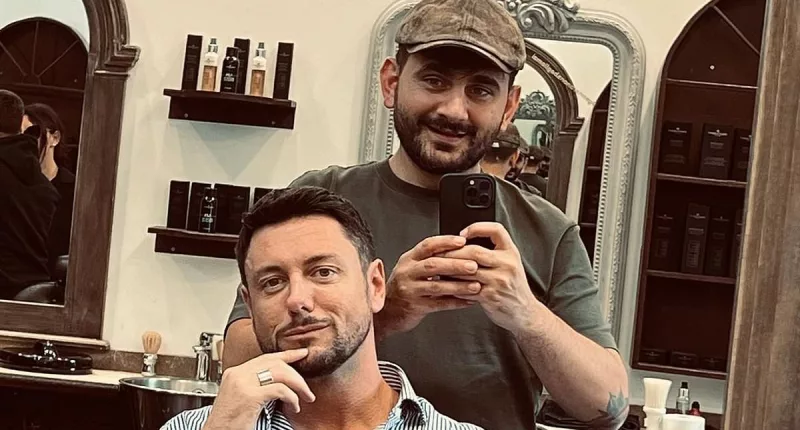 Meloni's ex-partner cheers himself up with haircut after losing TV job