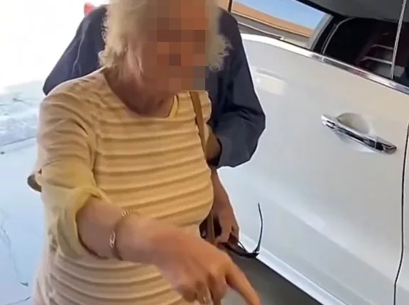 An elderly couple slammed a neighbor for chalk drawings that his kids allegedly drew on a sidewalk nearby